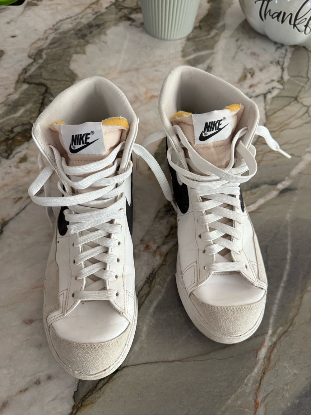Nike White High-Top Sneakers with Black Swoosh